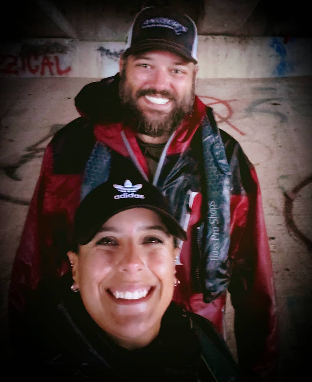 Ryan standing behind Katie under a bridge during a white squall at the KAFW/NTXKC Tournament in May 2019